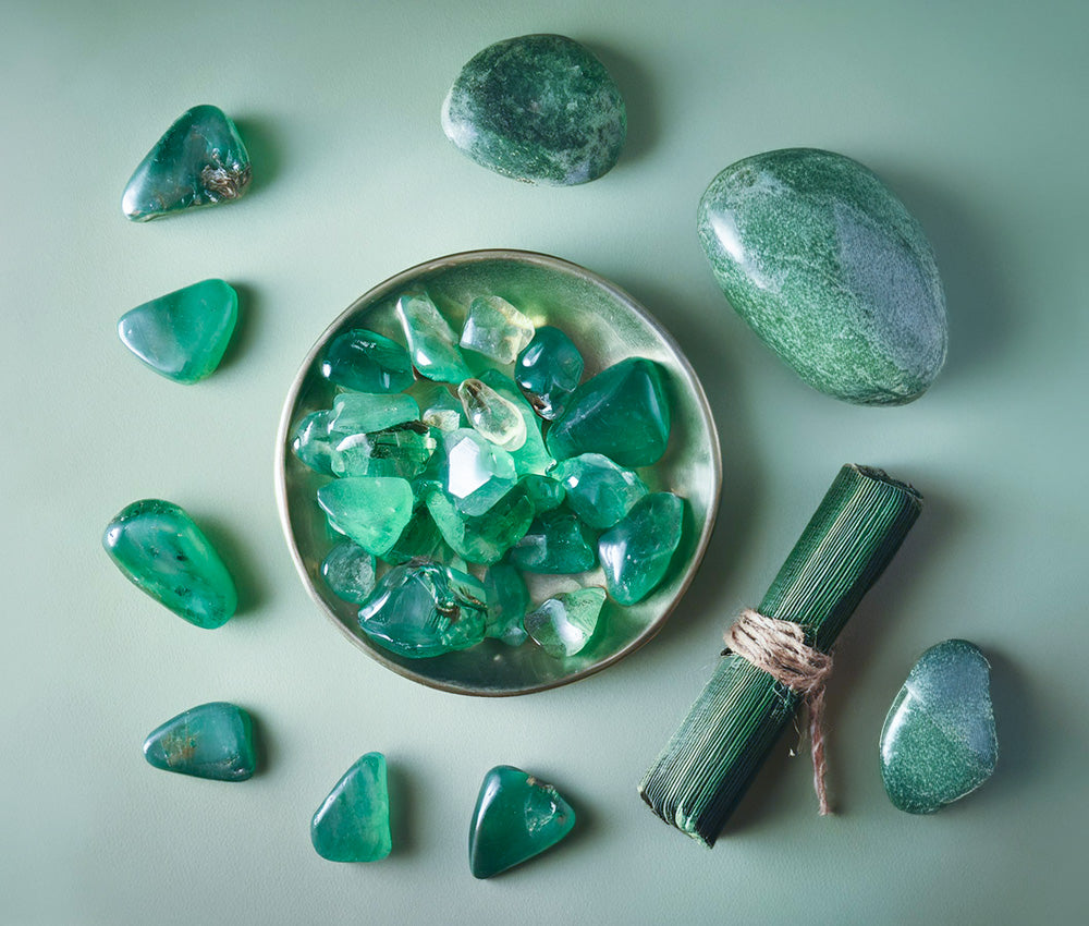 Aventurine gemstones displayed on a neutral background, symbolizing luck, abundance, and success with a soft green gradient.