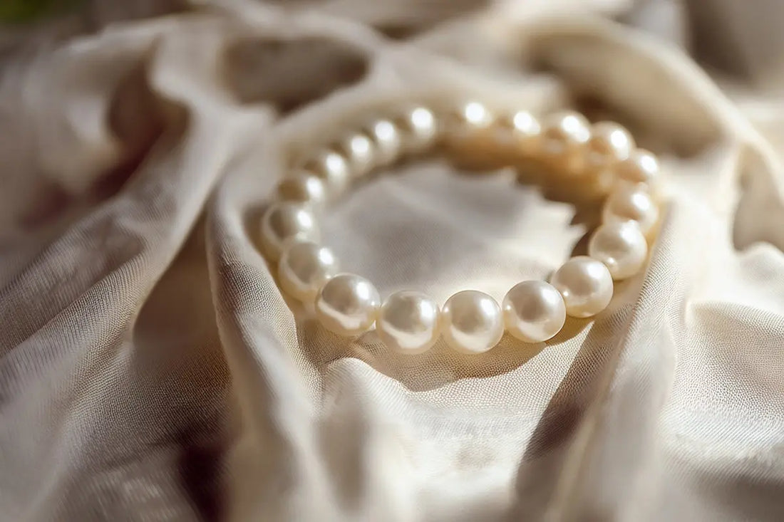 Freshwater pearl bracelet on white silk with natural luster.