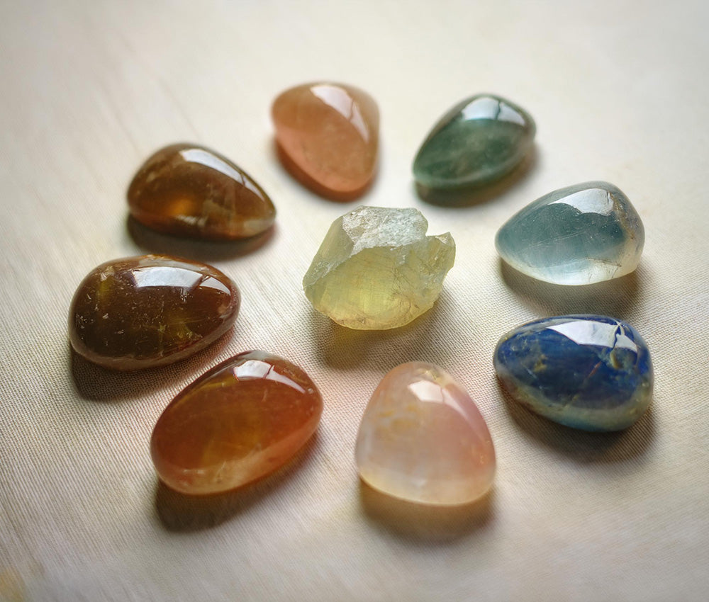 Zircon stones arranged by color, highlighting their connections to multiple chakras for clarity, confidence, and emotional healing.