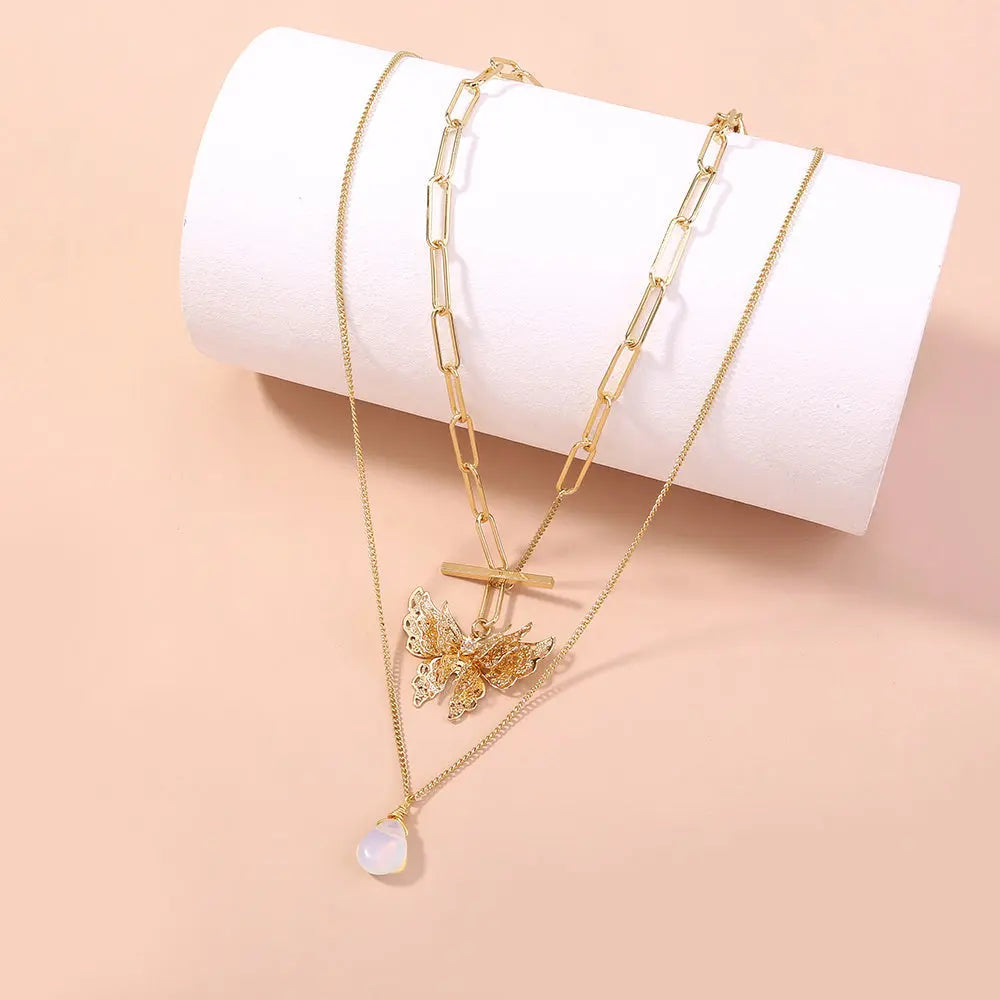 Elegant Gold Layered Necklace with Butterfly Pendant Gems Ritual