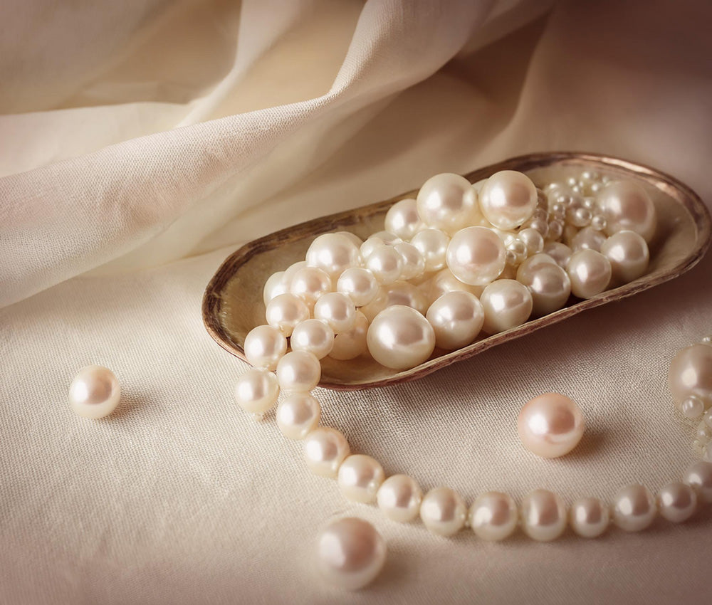 Natural pearls on a light background, symbolizing purity, wealth, and historical significance across cultures.