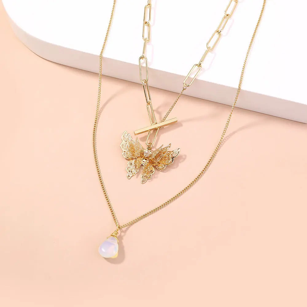 Elegant Gold Layered Necklace with Butterfly Pendant Gems Ritual