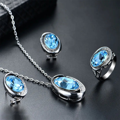 Luxurious Three-Piece Jewelry Set with Oval-Cut Blue Gemstone Gems Ritual