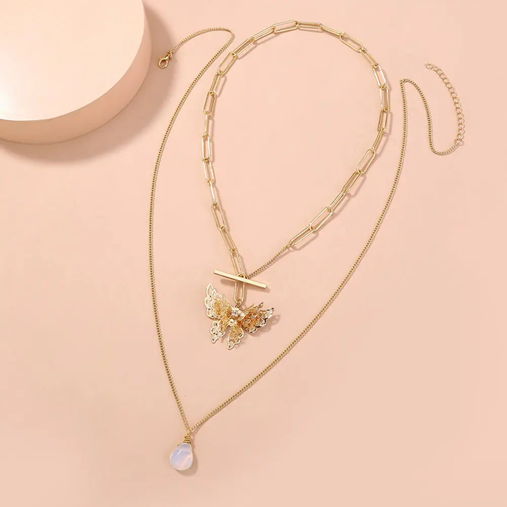 Elegant Gold Layered Necklace with Butterfly Pendant Gems Ritual